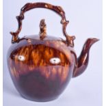 AN ANTIQUE STAFFORDSHIRE TREACLE GLAZED TEAPOT AND COVER. 22 cm x 15 cm.