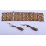 A VINTAGE SILVER GILT BRACELET and matching earrings. (3)