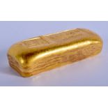 A CHINESE YELLOW METAL INGOT. 182 grams. 6.5 cm x 2.5 cm.