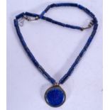 AN EARLY 20TH CENTURY CARVED LAPIS LAZULI NECKLACE, formed with sectional cylindrical beads. 56 cm l