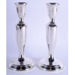 A PAIR OF SILVER CANDLESTICKS. 28 oz (weighted). 19 cm high.