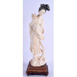 AN EARLY 20TH CENTURY JAPANESE IVORY OKIMONO, in the form of a geisha. 28 cm.
