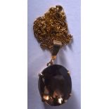 A VINTAGE GOLD SMOKEY QUARTZ NECKLACE. 14 grams.