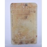 A CHINESE CARVED JADE TABLET. 6.5 cm x 4 cm.