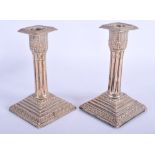 A PAIR OF ANTIQUE OLD SHEFFIELD PLATED CANDLESTICKS. 15 cm high.
