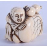 AN EARLY 19TH CENTURY JAPANESE EDO PERIOD CARVED IVORY NETSUKE. 3.5 cm x 3 cm.