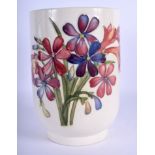 A MOORCROFT SPRING FLOWER WHITE VASE of cylindrical form. 19 cm high.