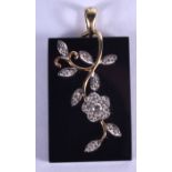 A VINTAGE GOLD AND DIAMOND PENDANT. 2 cm x 2.5 cm.