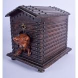 A RARE ANTIQUE BAVARIAN BLACK FOREST CARVED WOOD DOG KENNEL with painted dog exiting the kennel. 24