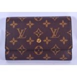 A LOUIS VUITTON PURSE. 16 cm wide.