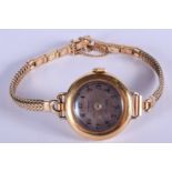 A VINTAGE 18CT GOLD TIFFANY & CO WRISTWATCH with 10k gold filled strap. 21 grams overall. 2.5 cm wid