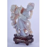 A RARE CHINESE CARVED OPAL FIGURE OF GUANYIN, together with a silver inlaid stand. 8 cm high.