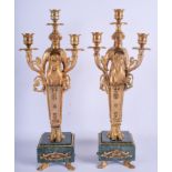 A PAIR OF CONTINENTAL EMPIRE STYLE BRONZE CANDLESTICKS. 45 cm high.