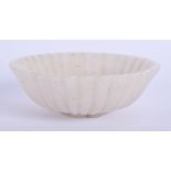 A MIDDLE EASTERN MUGHAL CARVED WHITE JADE MOULDED TEABOWL. 8.5 cm wide.