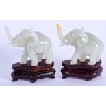 A PAIR OF 1920S CHINESE JADE ELEPHANTS. 6 cm wide.