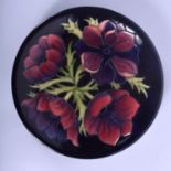 A BOXED MOORCROFT ANEMONE PLATE. 26 cm diameter.