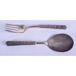 A PAIR OF VINTAGE SILVER HANDLED TOOLS. 22 cm long.