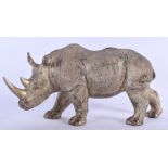 A FIGURE OF A RHINOCEROS, modelled standing. 32 cm wide.