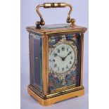 AN EARLY 20TH CENTURY FRENCH BRASS CHAMPLEVE ENAMEL CLOCK decorated with foliage. 11 cm high inc han