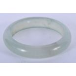 A CHINESE JADE BANGLE. 7.25 cm wide.