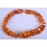 A LONG STRING OF AMBER. 105 cm long.