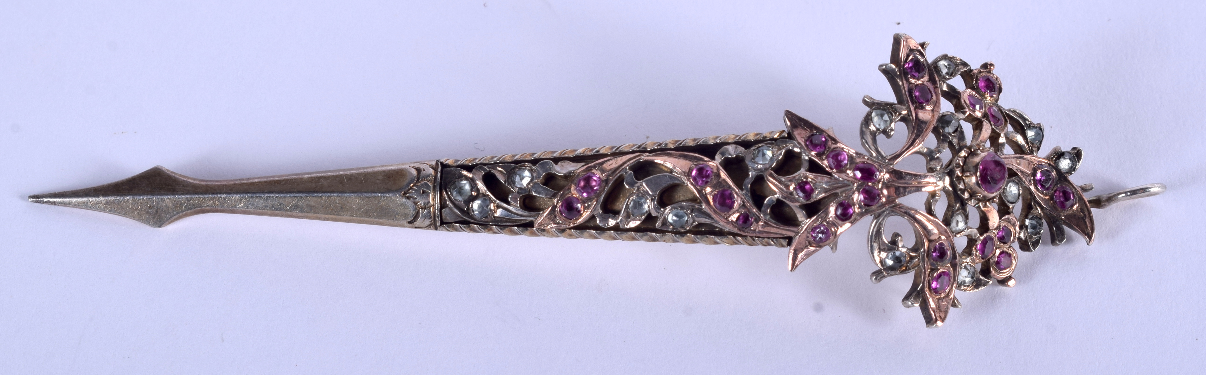 AN ANTIQUE YELLOW METAL AND RUBY SWORD PENDANT. 10 cm long.