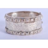 A VINTAGE SILVER BANGLE. 7 cm wide.