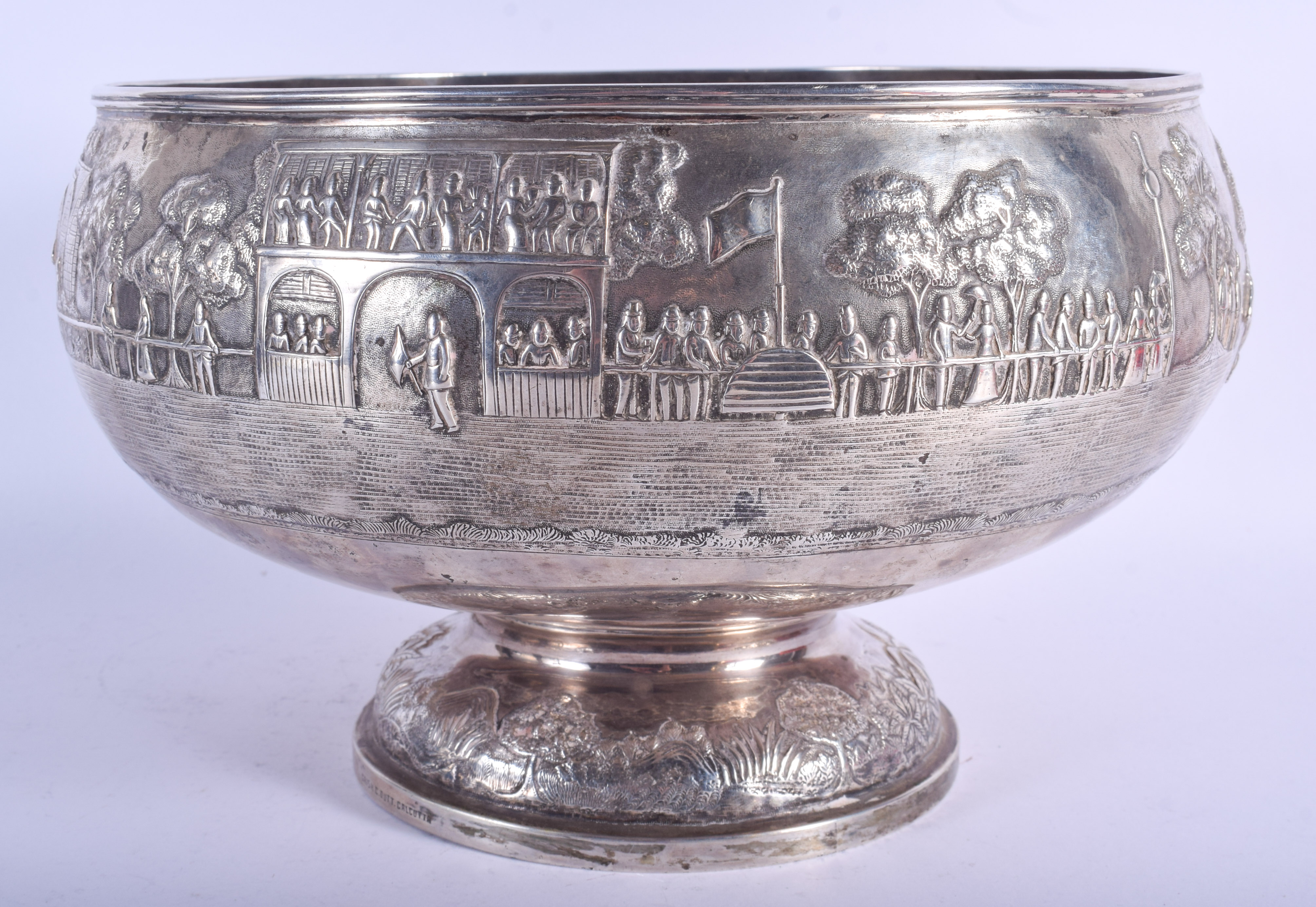 A GOOD 19TH CENTURY INDIAN COLONIAL KUTCH SILVER EMBOSSED BOWL decorated with figures within landsca