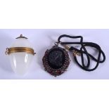 A VINTAGE EGG PENDANT BOX and a jet pendant. (2)