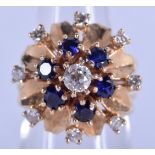 AN 18CT GOLD DIAMOND AND SAPPHIRE RING. 11.6 grams. M/N.
