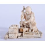 A 19TH CENTURY JAPANESE MEIJI PERIOD CARVED IVORY OKIMONO modelled as a carpenter. 7 cm x 6 cm.