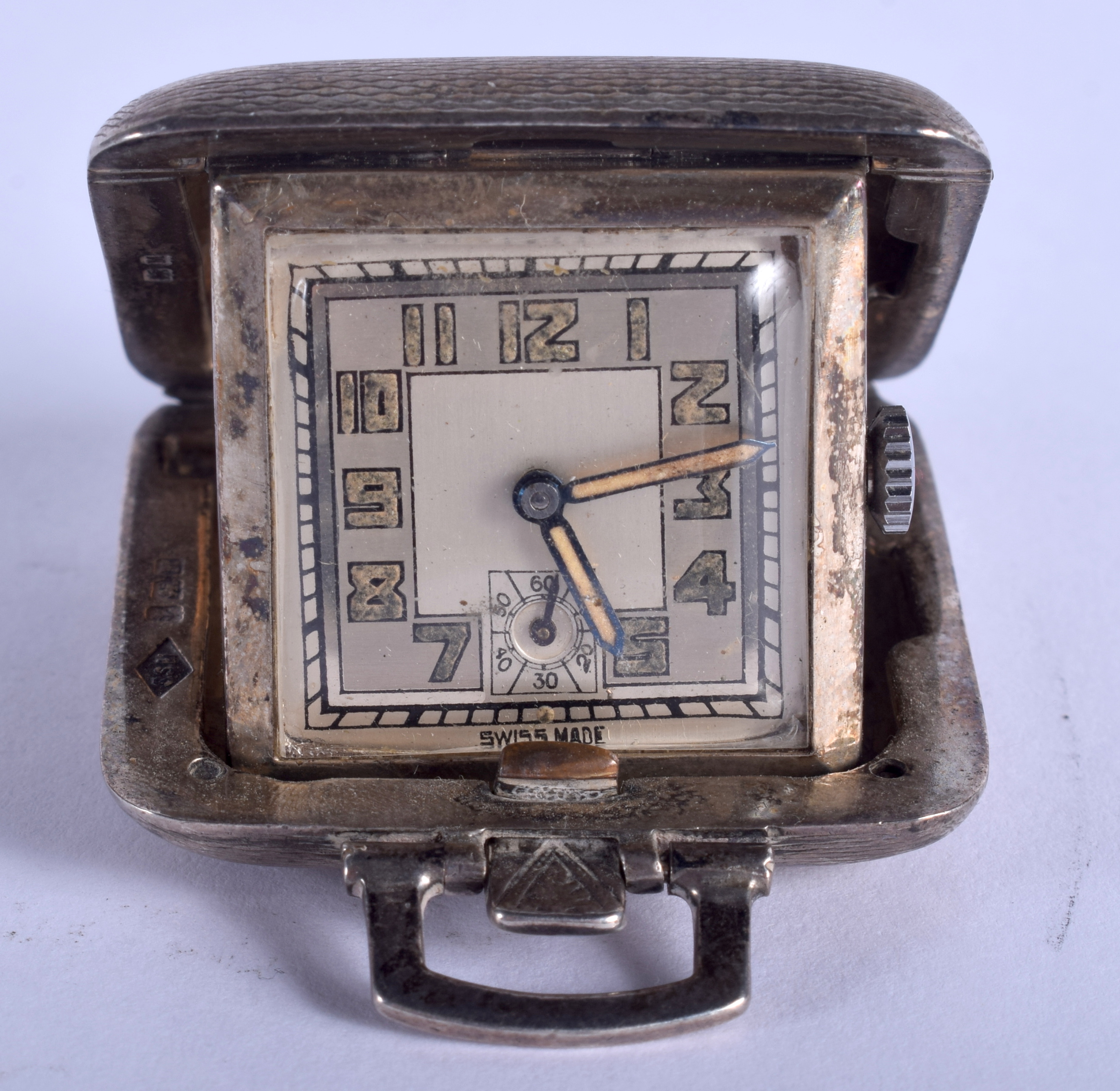 AN ART DECO SILVER PURSE WATCH. 3.25 cm square.