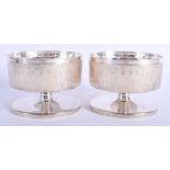 A STYLISH PAIR OF 1960S SILVER CANDLE HOLDERS by Gerald Benny. London 1964. 43.5 oz. 9 cm x 11 cm.