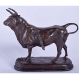 A BRONZE FIGURE OF A COW. 18 cm wide.