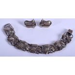 AN ARTS AND CRAFTS SILVER BRACELET with matching earrings. 14 cm long. (3)