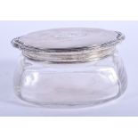 A VINTAGE SILVER TOPPED GLASS JAR. 11 cm wide.