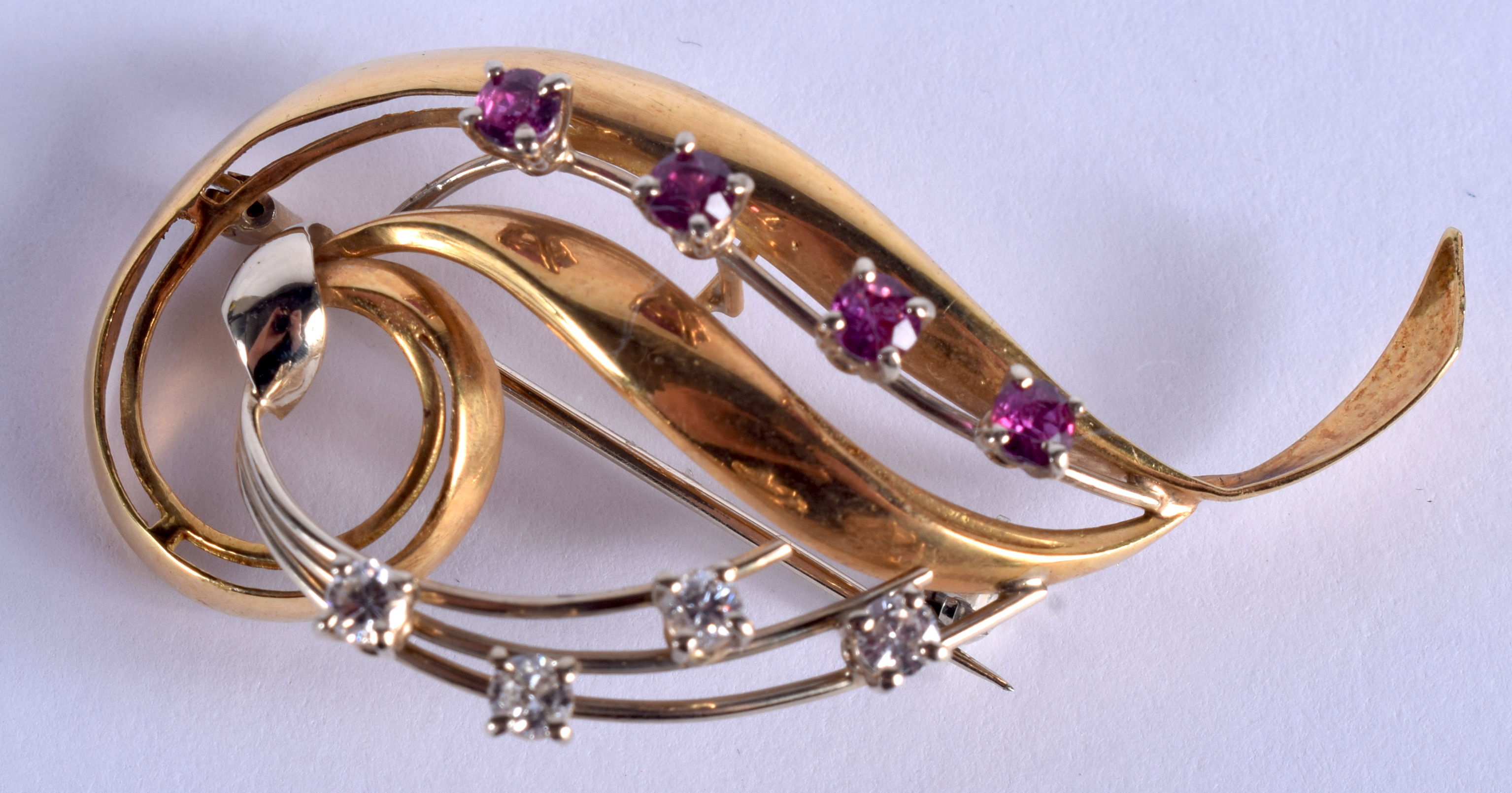 AN ANTIQUE 15CT GOLD DIAMOND AND RUBY BROOCH. 7.7 grams. 5.5 cm x 2.5 cm.