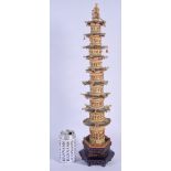 A LARGE 19TH CENTURY CHINESE CARVED AND PAINTED IVORY TOWER decorated with figures within a temple.