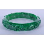 A CHINESE JADEITE BANGLE. 7.25 cm wide.