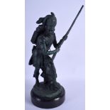 A BRONZE SCULPTURE OF A STANDING SOLDIER. 42 cm high.