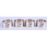 FOUR SILVER NAPKIN RINGS. 2.6 oz. 4 cm wide. (4)