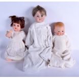 A GROUP OF THREE ANTIQUE PORCELAIN HEADED DOLL including Armand Marseille. (3)