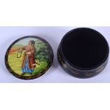 A UKRANIAN / RUSSIAN LACQUER BOX AND COVER, decorated with a male in landscape. 7.75 cm wide.