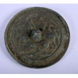 A CHINESE BRONZE HAND MIRROR. 10.5 cm diameter.