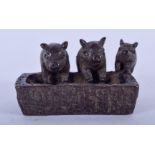 A JAPANESE BRONZE OKIMONO FORMED AS THREE PIGS. 4.75 cm wide.