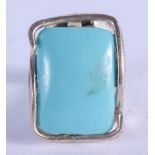 A SILVER AND TURQUOISE RING. M.