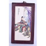 A CHINESE PORCELAIN PLAQUE, decorated with two females in an interior. 29 cm x 16 cm.