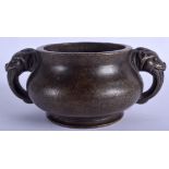 A CHINESE TWIN HANDLED BRONZE CENSER BEARING XUANDE MARKS. 20 cm wide.