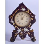 AN ANTIQUE ENAMELLED GILT METAL MINIATURE CLOCK. 4 cm x 3 cm.