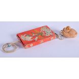 AN EARLY 20TH CENTURY CHINESE SILK WORK TAG NUT PURSE. 11 cm x 7 cm.